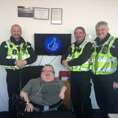 Accessible News founder Richard Jones with Inspector Robert Blunt, PCSO Ceri Price and PC Nick James