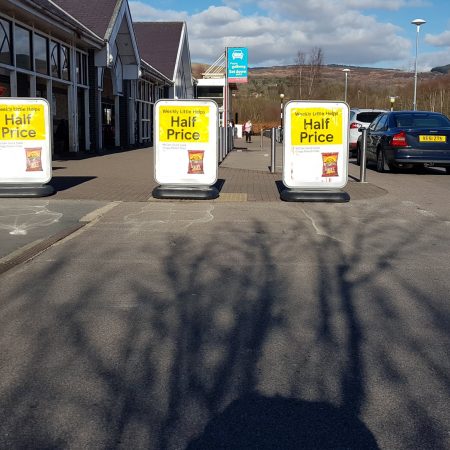 Three Cyclone Bollards obstructing the dropped kerb in Tesco Aberdare
