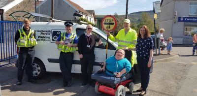 This image is of the team involved in the Day of Action outside Cwmdare Primary School. The picture consists of PCSO's Toomey and Price, RCT Parking Enforcement Officer, Accessible News founder Richard Jones, Mrs Evans (Head Teacher) and Simon the school’s crossing patrol person.