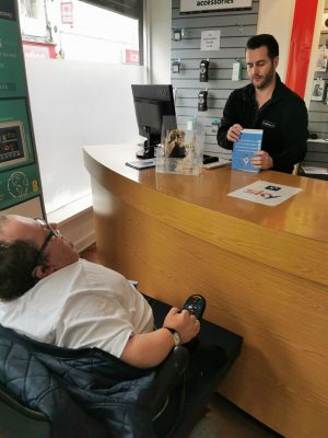 Accessible News founder Richard Jones discussing the Considerate Parking Campaign with Fonehouse Store Manager Robert George